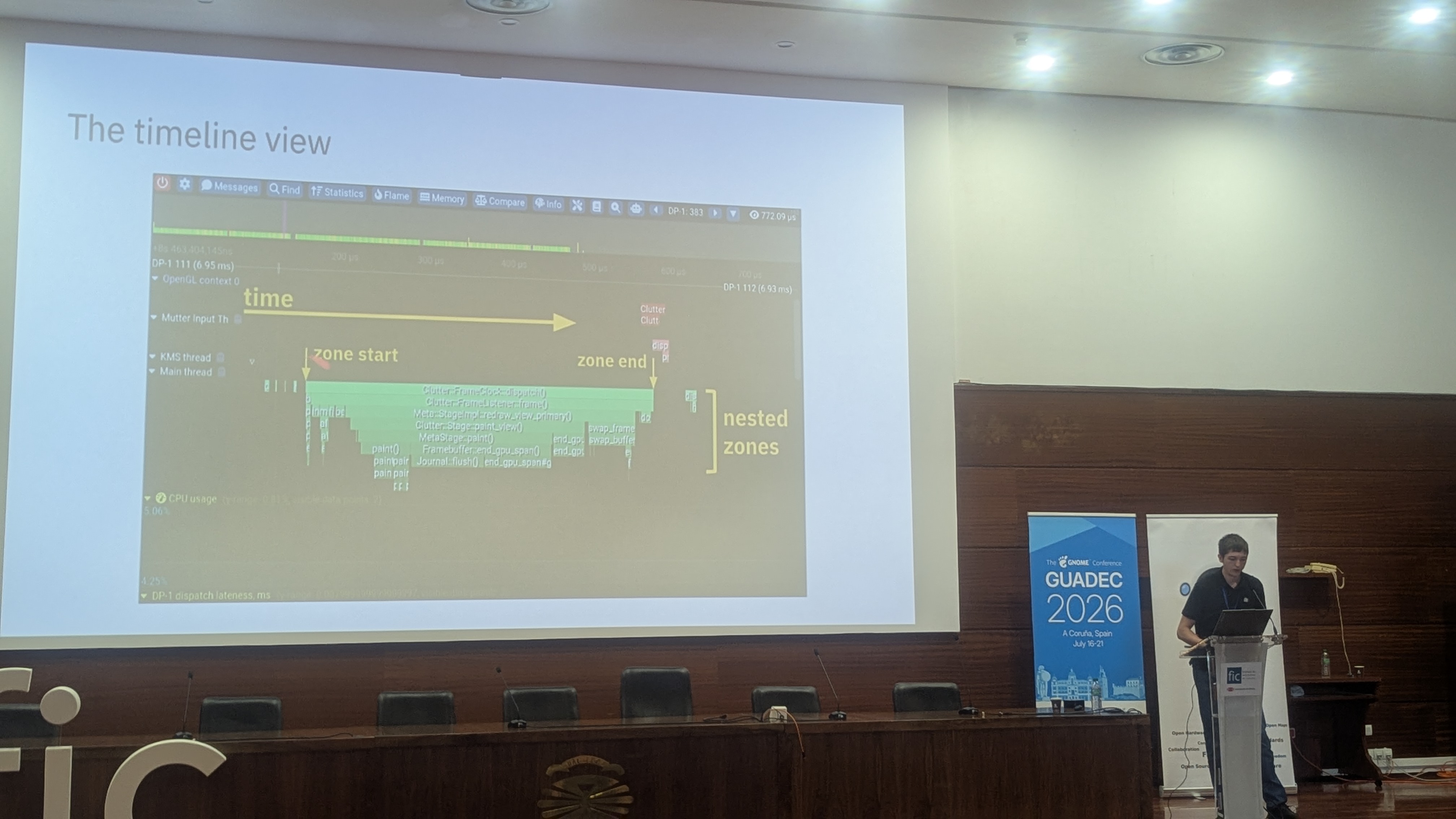 Photo of Ivan Molodetskikh presenting Tracy's timeline UI at his GUADEC talk